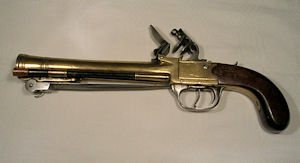 Click to enlarge a flintlock boxlock brass barrelled blunderbuss pistol of approximately 12 bore by Waters & Co